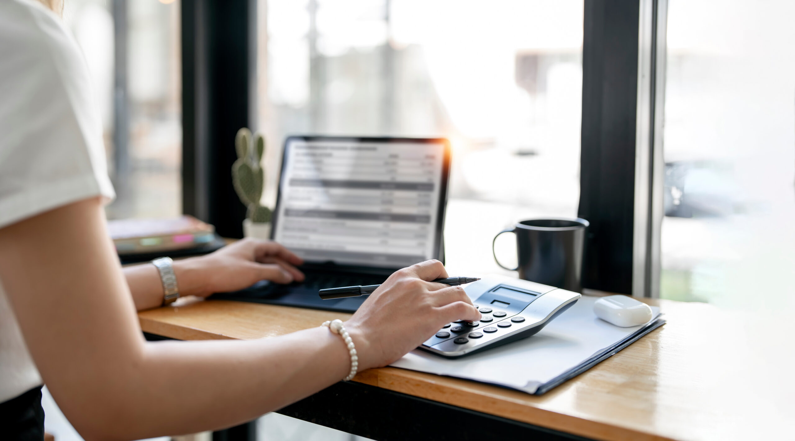 accountant working Financial investment on calculator, calculate Businesswoman or accountant working Financial investment on calculator, calculate, analyze business and marketing growth on financial document data graph, Accounting, Economic, commercial concept.